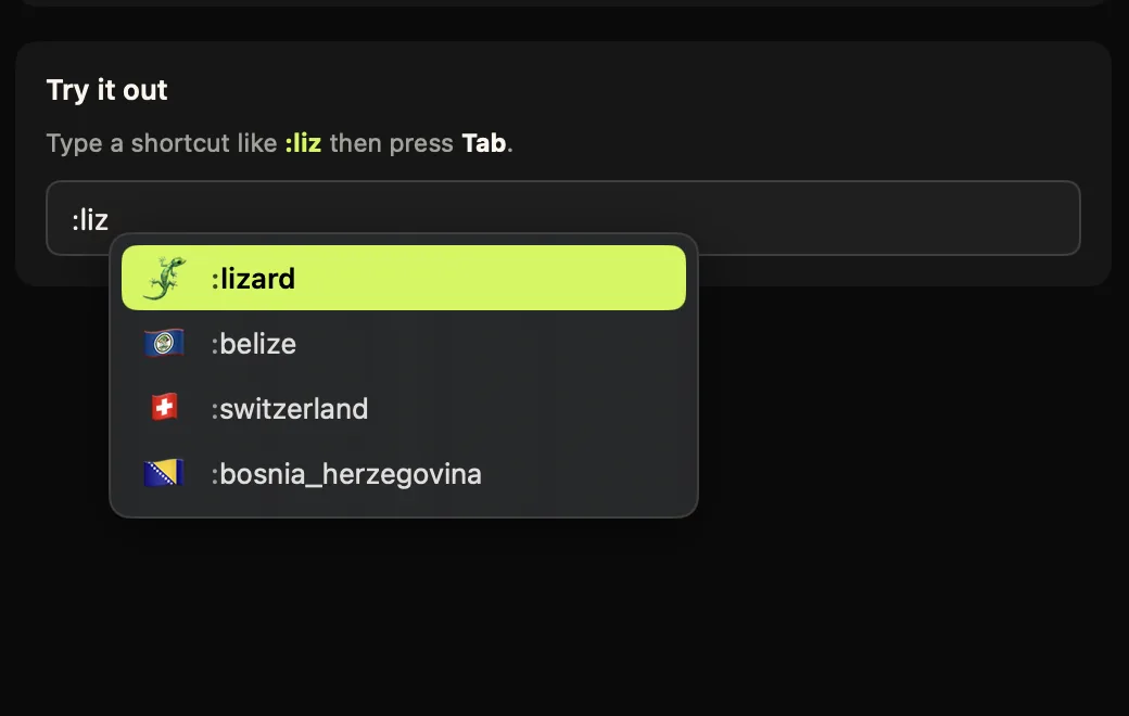 The Comoji suggestion popup under a text field where :liz has been typed, with 🦎 highlighted at the top