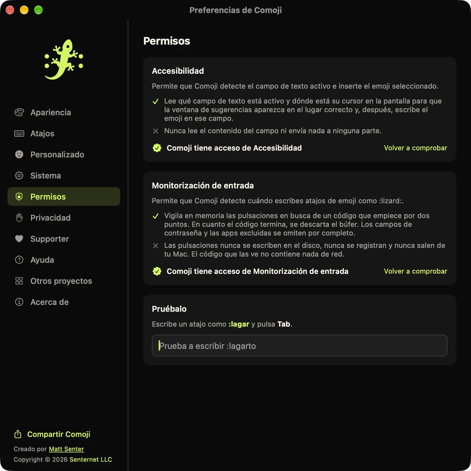 Preferencias de Comoji abiertas en la pestaña Permisos, con Accesibilidad y Monitorización de entrada concedidos y un campo Pruébalo