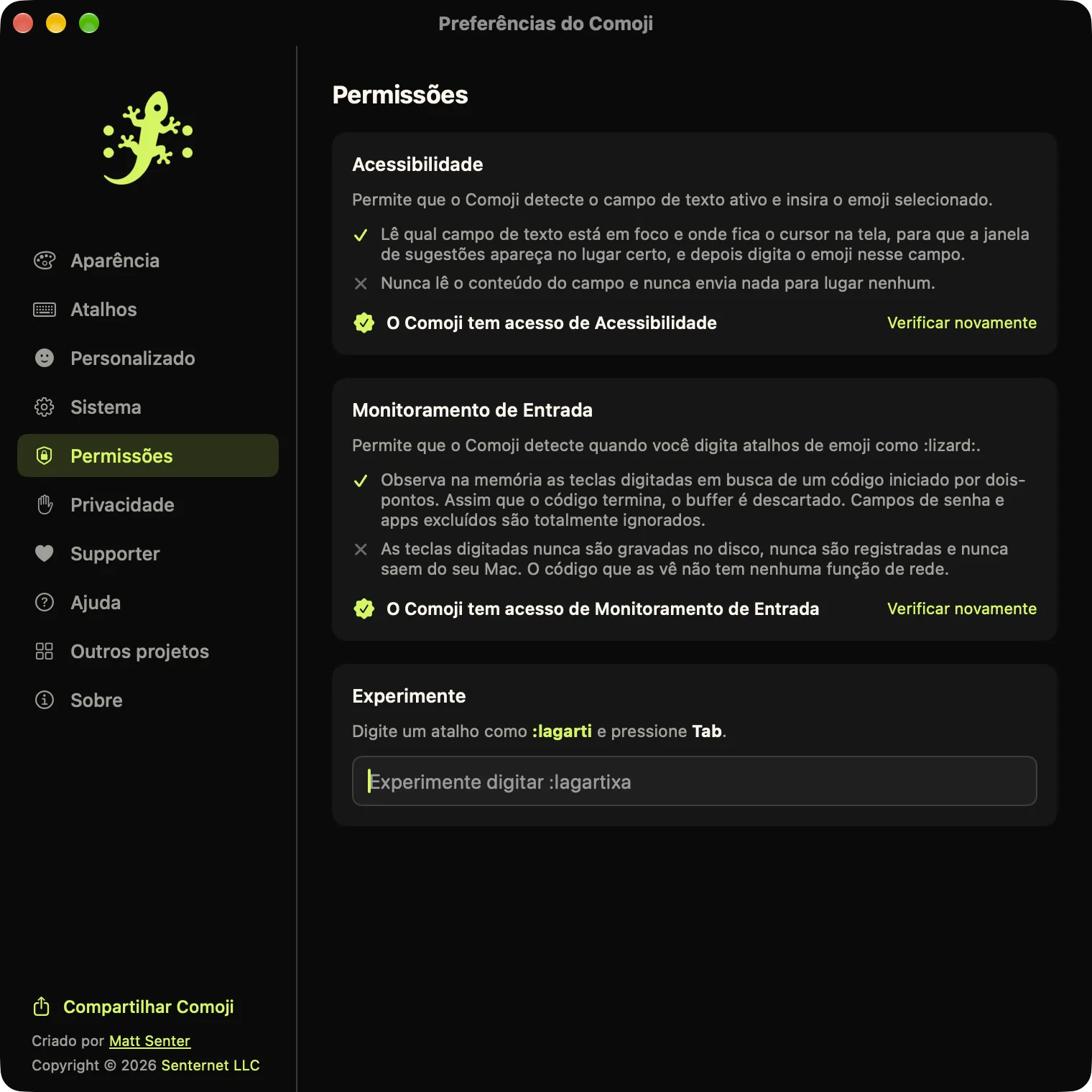 Preferências do Comoji abertas na aba Permissões, com Acessibilidade e Monitoramento de Entrada concedidos e um campo Experimente